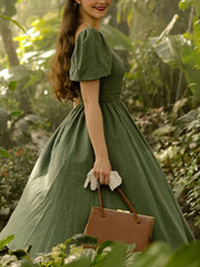 Green dress with puffed sleeves and Queen Anne neckline