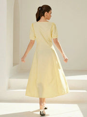 Long striped dress with V-neckline and puff sleeves