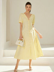 Long striped dress with V-neckline and puff sleeves