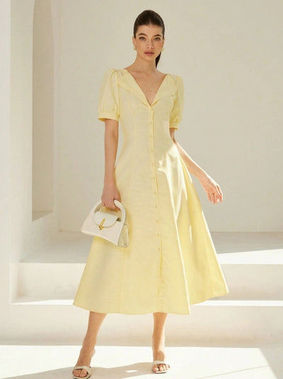 Long striped dress with V-neckline and puff sleeves